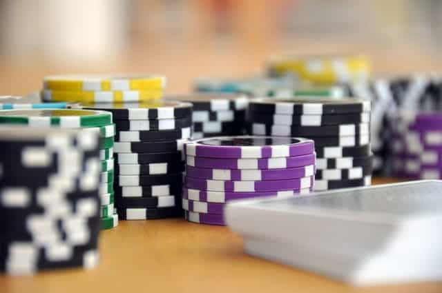 Casino chips and a deck of playing cards.