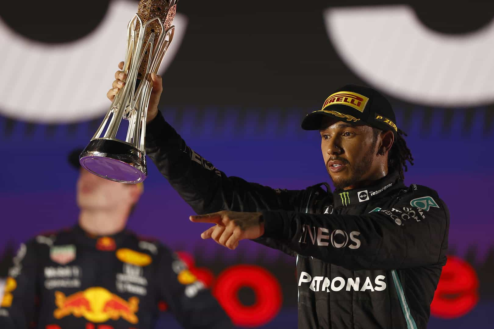 Lewis Hamilton hold his Aaudi Arabian Grand Prix trophy aloft.