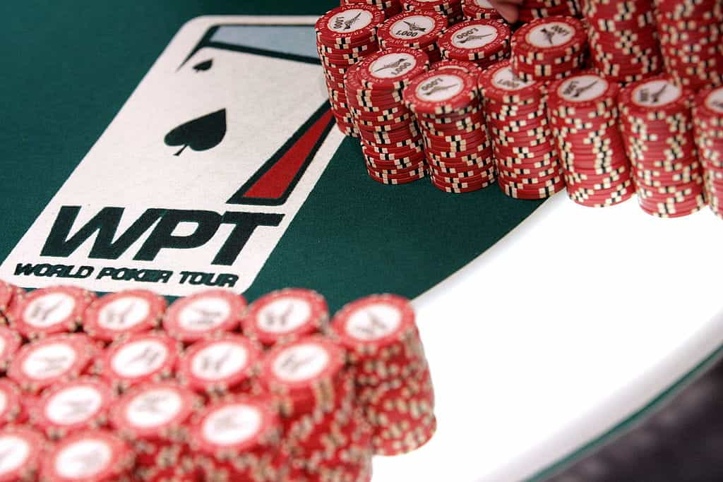 Chips neatly stacked on a WPT branded poker table..