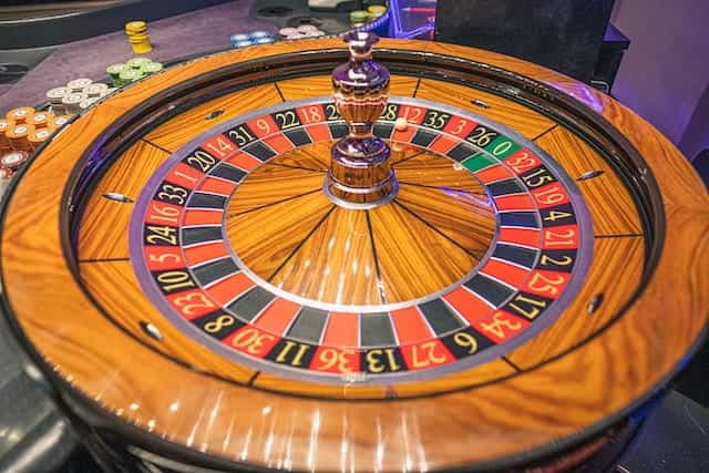 A wooden roulette wheel.