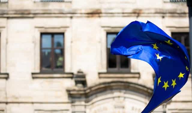 The EU flag waves in the wind.