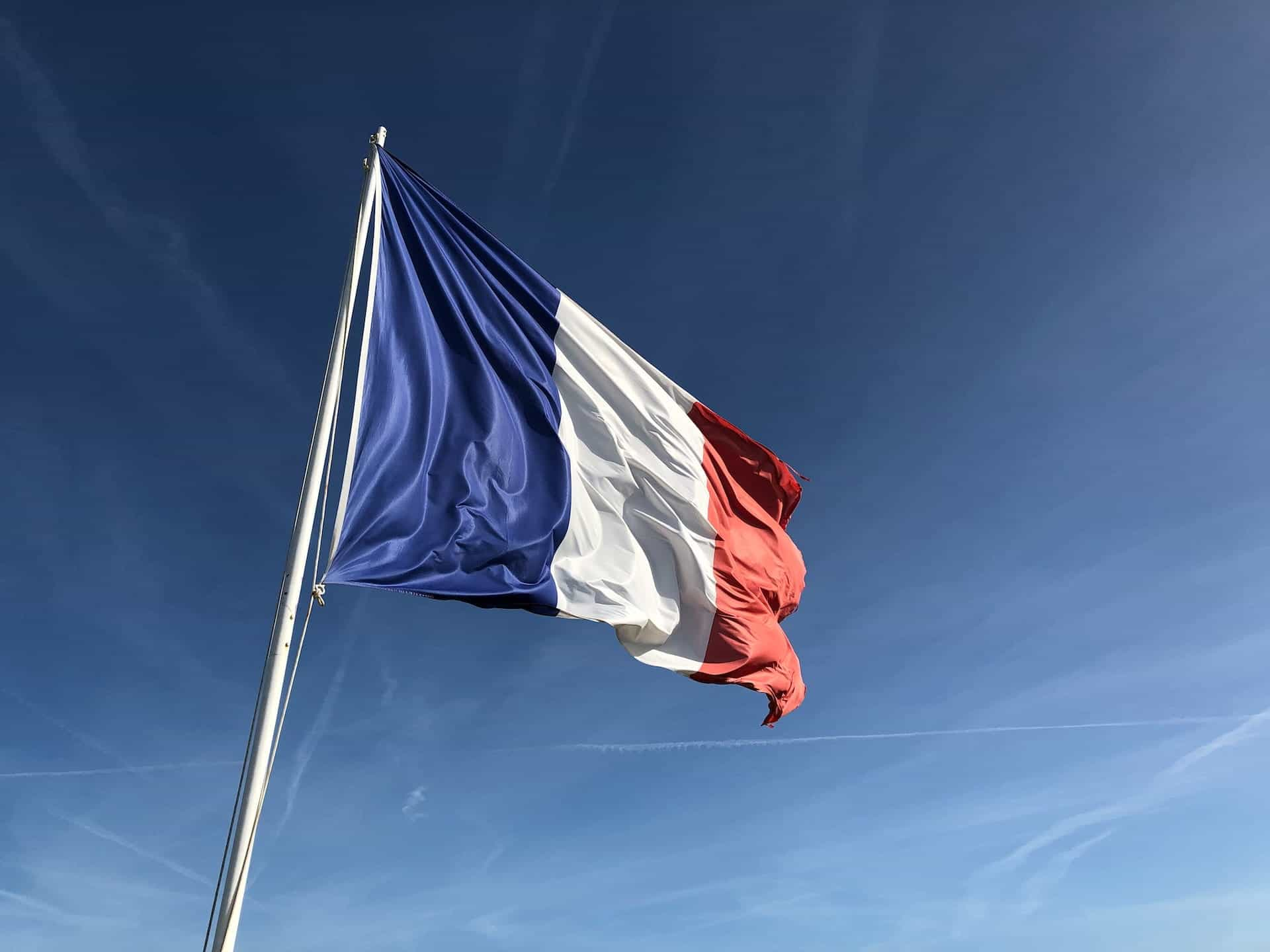 French flag blowing in the wind.