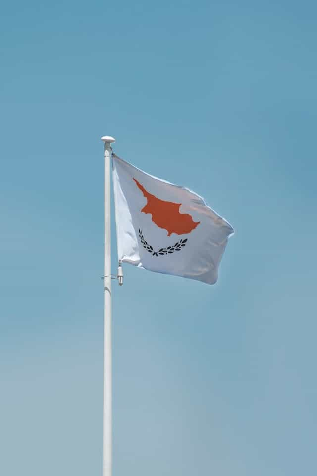 A flag against a blue sky.